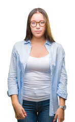 Obraz premium Young caucasian beautiful business woman wearing glasses over isolated background with serious expression on face. Simple and natural looking at the camera.