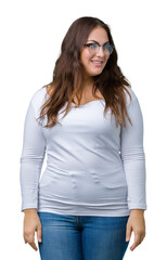 Obraz premium Beautiful plus size young woman over isolated background looking away to side with smile on face, natural expression. Laughing confident.