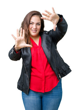 Beautiful plus size young woman wearing a fashion leather jacket over isolated background Smiling doing frame using hands palms and fingers, camera perspective