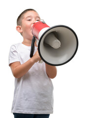 Dark haired little child holding megaphone annoyed and frustrated shouting with anger, crazy and yelling with raised hand, anger concept