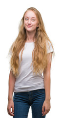 Obraz premium Blonde teenager woman with a happy face standing and smiling with a confident smile showing teeth