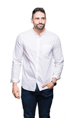 Fototapeta premium Young business man over isolated background smiling looking side and staring away thinking.