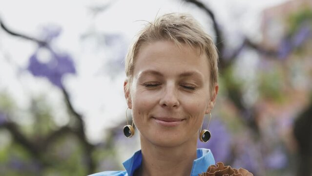 An Adult Stylish Woman With Short Hair Wearing Big Earrings