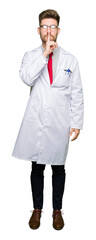 Fototapeta premium Young handsome scientist man wearing glasses asking to be quiet with finger on lips. Silence and secret concept.
