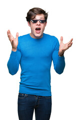 Young man wearing funny thug life glasses over isolated background celebrating crazy and amazed for...