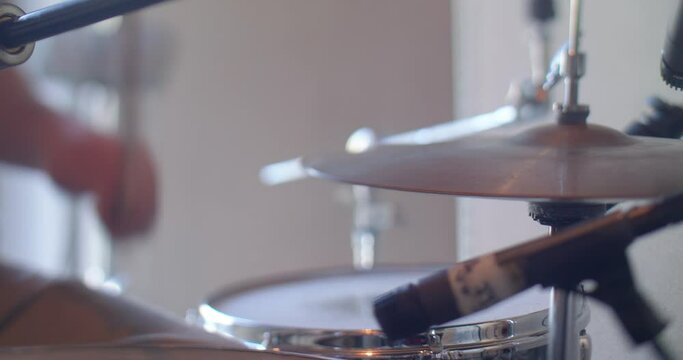 Close-up of hi-hat in drum set, partly in focus