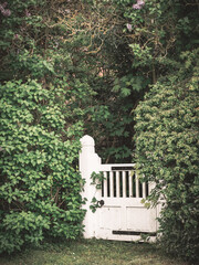 white gate in front of a house