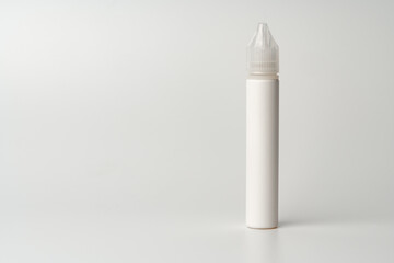 Refill liquid for electronic cigarettes on gray background