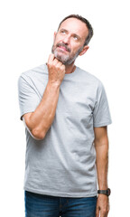 Middle age senior hoary man over isolated background with hand on chin thinking about question,...