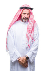 Senior arab man wearing keffiyeh over isolated background skeptic and nervous, frowning upset because of problem. Negative person.