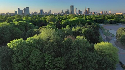 Aerial, drone panorama of Warsaw city during sunset. View from Pole Mokotowskie Park 