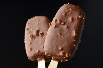 Chocolate cake pops ice cream on black background