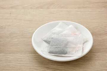Tea Bag or tea sachet on white plate

