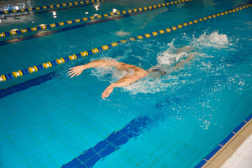 Man doing water exercises in butterfly style