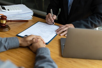 Businessman and lawyer discuss the contract document. Treaty of the law. Sign a contract business. Consultation of Businessman and lawyer or judge counselor, Law and Legal services concept.