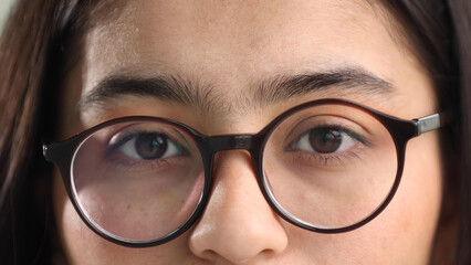 Close-up of closed female eyes in glasses