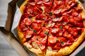 Pepperoni Pizza with Mozzarella cheese, salami, Tomato sauce, pepper, Spices in box