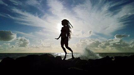 Silhouette of the satyr on the cliff. Dramatic panorama of rough sea with cloudy sky. Fantasy concept, background of god Pan, bright and contrasting colors in painted style. - obrazy, fototapety, plakaty
