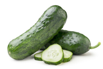 Ripe cucumbers and sliced pieces on a white background. Isolated