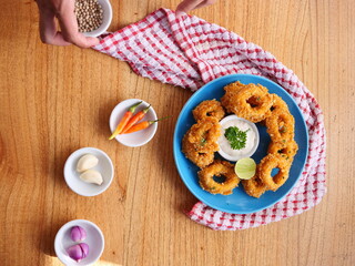 onion rings on wooden table
