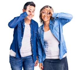 Couple of women wearing casual clothes doing ok gesture with hand smiling, eye looking through fingers with happy face.