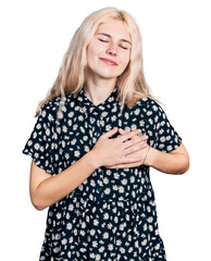 Young caucasian woman together smiling with hands on chest with closed eyes and grateful gesture on face. health concept.