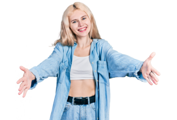 Young caucasian woman wearing casual clothes looking at the camera smiling with open arms for hug. cheerful expression embracing happiness.