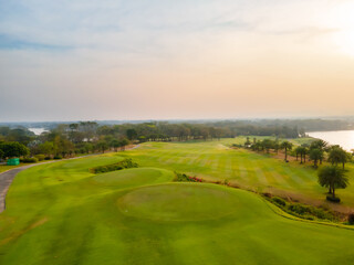 Golf Course with putting green background. Green grass and woods on a golf field