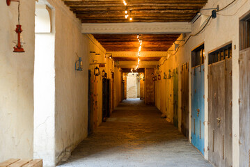 Narrow streets that create shade on a hot day in the old city of Dubai Creek and Bur district....