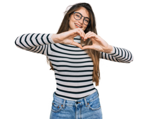 Young beautiful teen girl wearing casual clothes and glasses smiling in love doing heart symbol shape with hands. romantic concept.