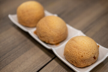 Baked pork buns, Dim Sum served on plate. Chinese food