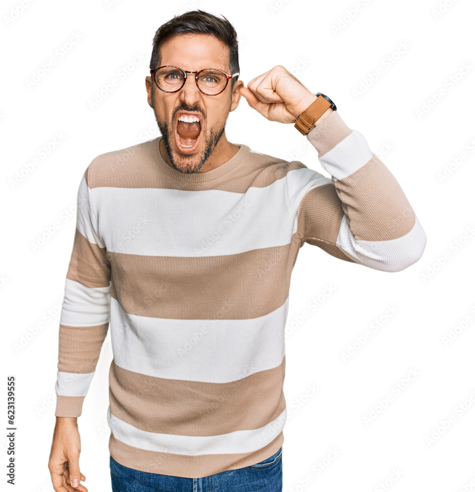 Sticker handsome man with beard wearing casual clothes and glasses angry and mad raising fist frustrated and