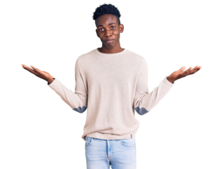 Young african american man wearing casual clothes clueless and confused expression with arms and hands raised. doubt concept.