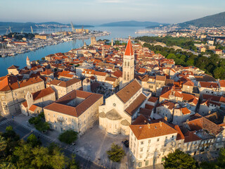 Amazing panoramic view of the picturesque town of Trogir in Croatia, the old town with beautiful historic buildings bathed in morning light, the promenades and the surrounding Adriatic Sea