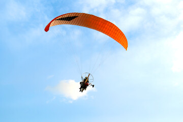 paraglider on blue sky