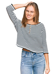Obraz premium Beautiful blonde woman wearing casual clothes confuse and wonder about question. uncertain with doubt, thinking with hand on head. pensive concept.