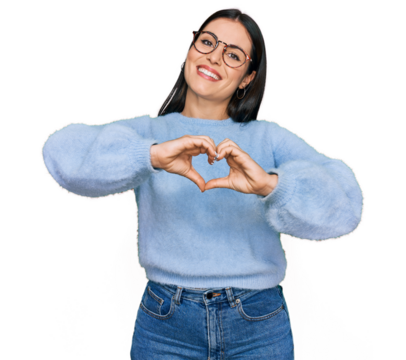 Young hispanic woman wearing casual clothes and glasses smiling in love doing heart symbol shape with hands. romantic concept.