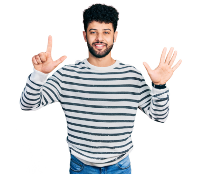 Young arab man with beard wearing casual striped sweater showing and pointing up with fingers number seven while smiling confident and happy.