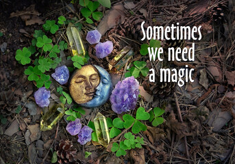 Sometimes we need a magic - inspiration quote. amulet of symbolic moon and crystal minerals on...