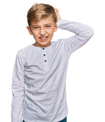 Little caucasian boy kid wearing casual clothes confuse and wonder about question. uncertain with...