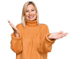 Middle age caucasian woman wearing casual winter sweater smiling cheerful offering hands giving assistance and acceptance.