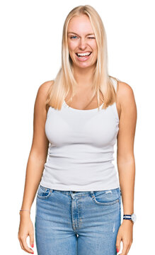 Young blonde girl wearing casual style with sleeveless shirt winking looking at the camera with sexy expression, cheerful and happy face.