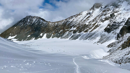 Top view of the Akkem glacier and the snow-covered Delaunay pass. Climbing Mount Belukha. Altai Mountains.