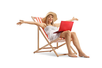 Happy young woman on a beach chair with a laptop computer