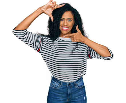Middle age african american woman wearing casual clothes smiling making frame with hands and fingers with happy face. creativity and photography concept.