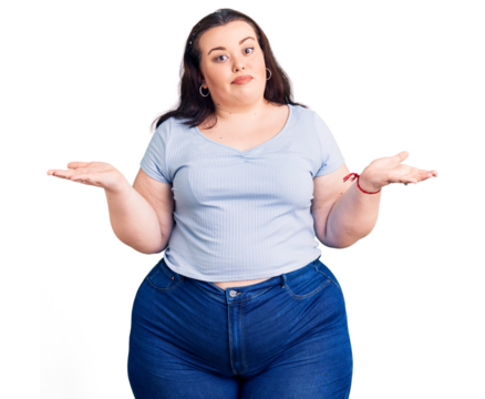 Young plus size woman wearing casual clothes clueless and confused expression with arms and hands raised. doubt concept.