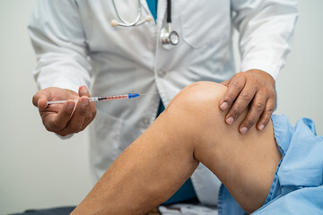 Asian doctor inject Hyaluronic acid platelet rich plasma into the knee of senior woman to walk...
