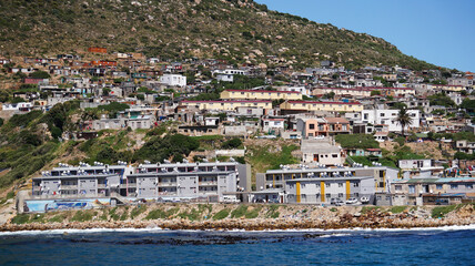 Fototapeta na wymiar Local South African township housing residence area around Hout Bay hill side landscape from ocean