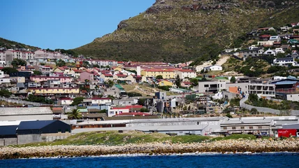 Fototapeten Local South African township housing residence area around Hout Bay hill side landscape from ocean © glowonconcept