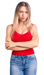Fototapeta premium Young beautiful blonde woman wearing casual clothes skeptic and nervous, disapproving expression on face with crossed arms. negative person.